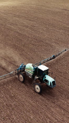 farm machine sprayer tractor. aerial view of modern farm machine sprayer on field