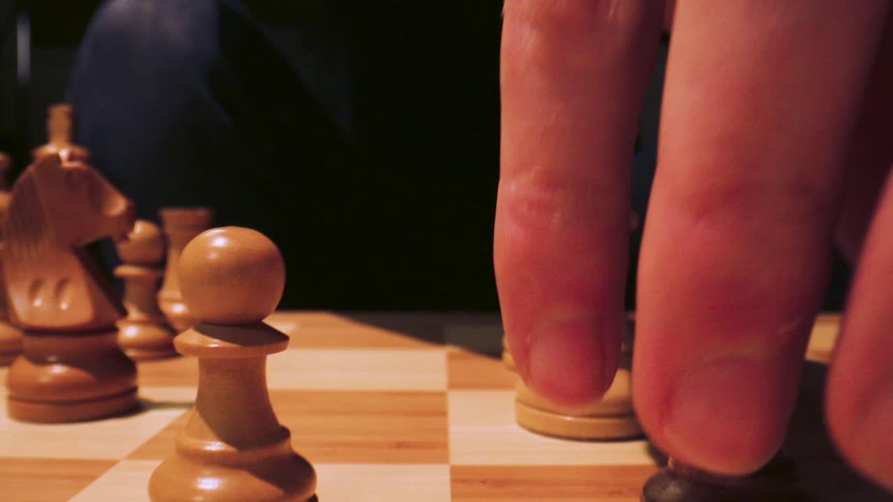 Slide through a chessboard as if it was giant with a macro lens. The knight takes the pawn.