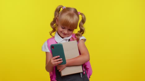 Funny-kid-blogger-primary-school-girl-taking-selfie-on-mobile-phone,-communicating-video-call-online