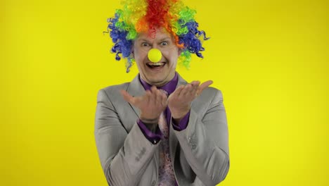 Clown-businessman-entrepreneur-boss-in-wig-receive-money.-Earnings-making-profit