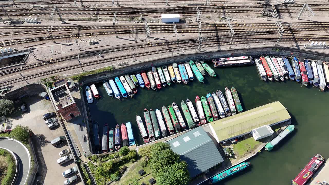 Overhead birds eye drone aerial view row of canal boats St Pancras Basin London