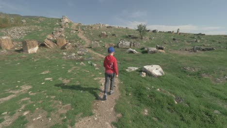 Boy-walking-to-the-ancient-ruins-in-Pamukkale-Turkey