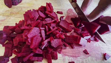 cutting beet with sharp chef knife macro shot, cooking process, preparing ingredients for tar tar, slow motion, shot on red weapon helium