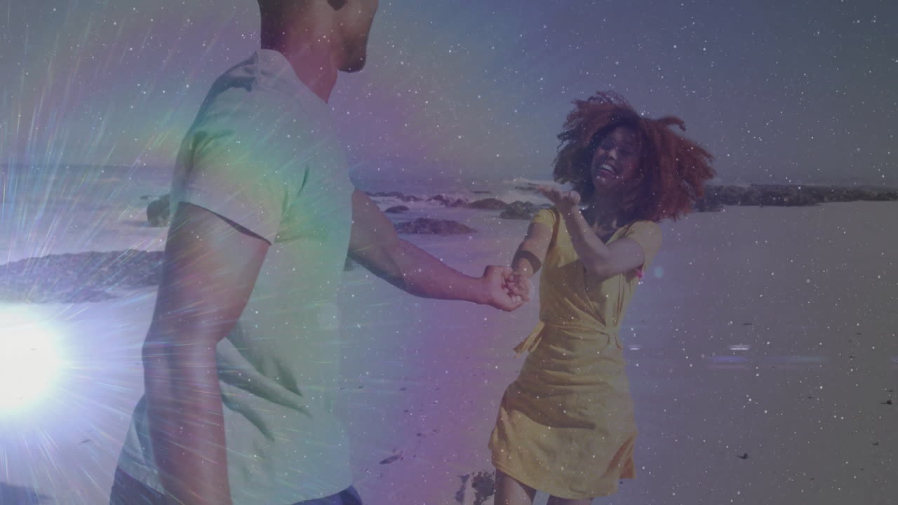 Holding hands on beach, couple with colorful animation overlay effects