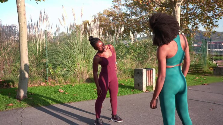 Two women exercising in a park