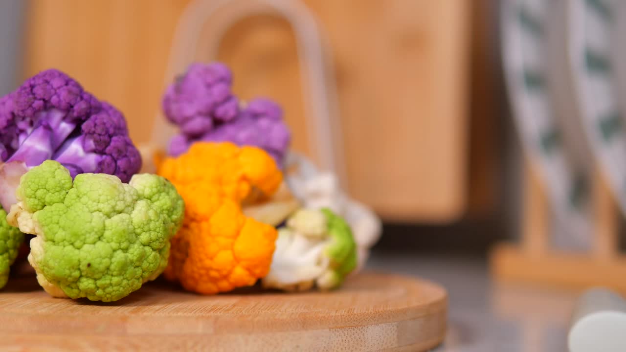 Colorful Cauliflower on a Wooden Board
