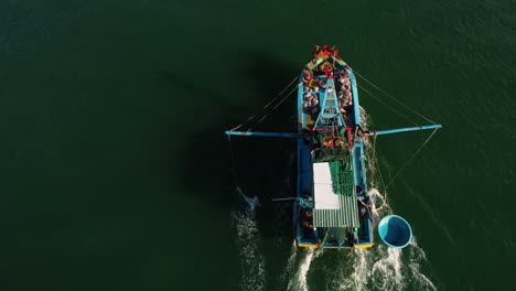 local vietnamese fishing vessel returns from fishing grounds, aerial