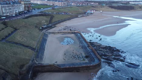 drone retreating to reveal tynemouth longsands beach and coastline - newcastle upon tyne
