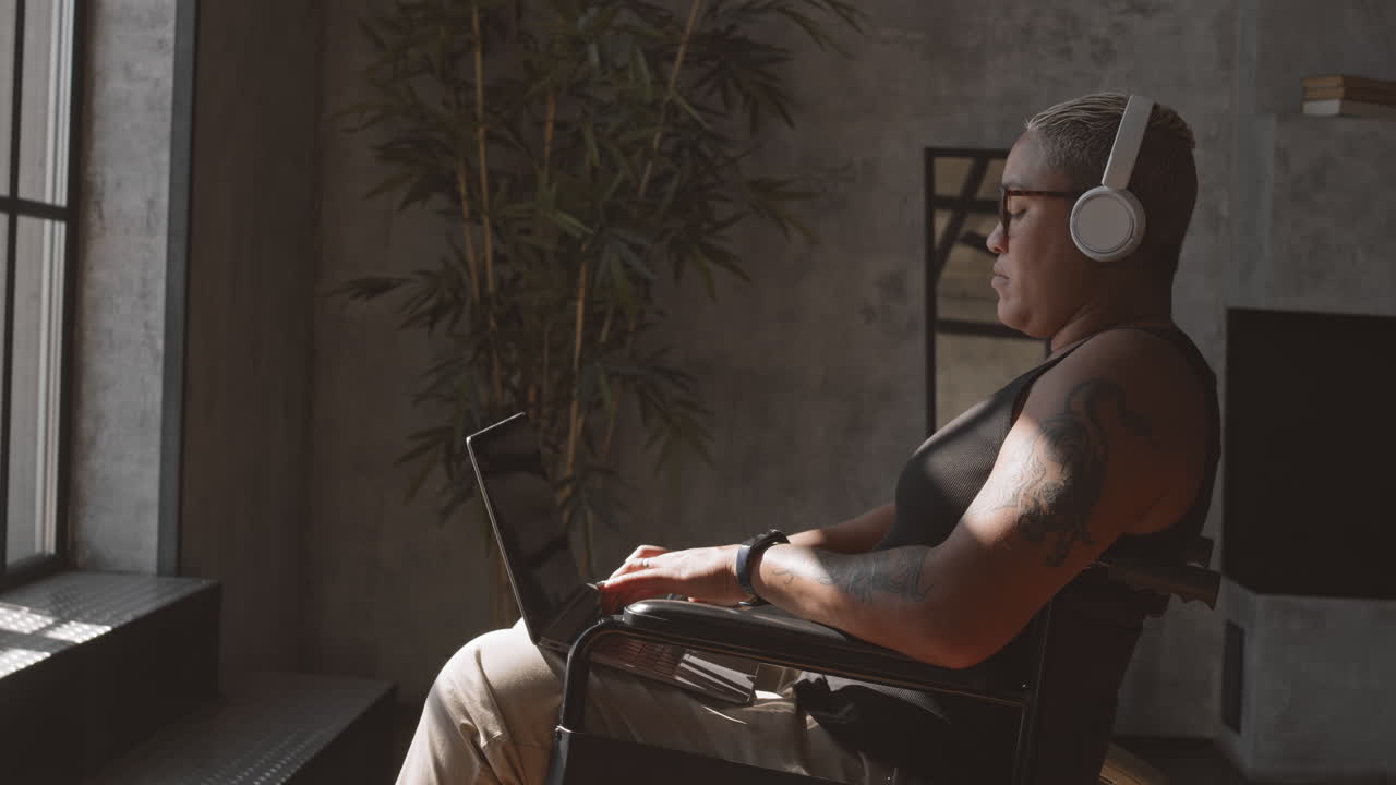 Woman with Disability Typing on Laptop