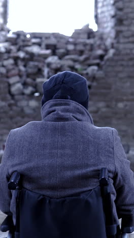 disabled person contemplating in abandoned building