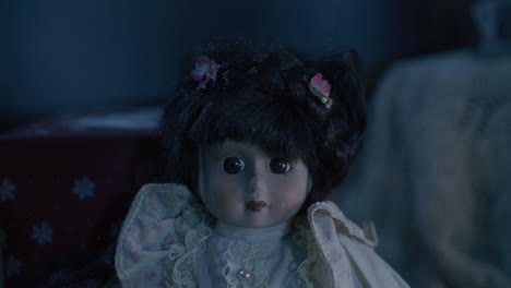 antique porcelain doll in a dark setting