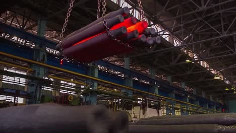 hot metal pipes in a steel mill