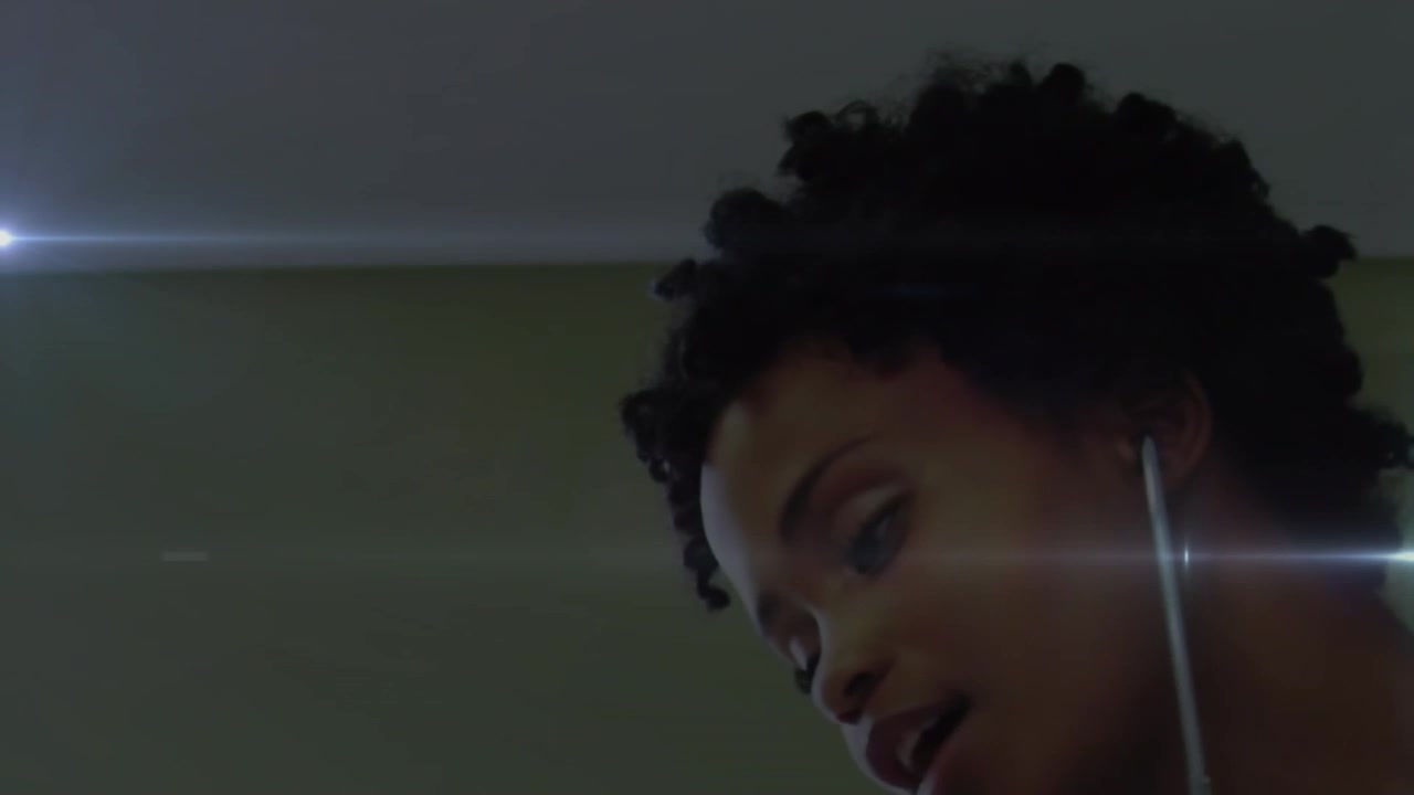 Animation of light spots over african american female doctor treating patient