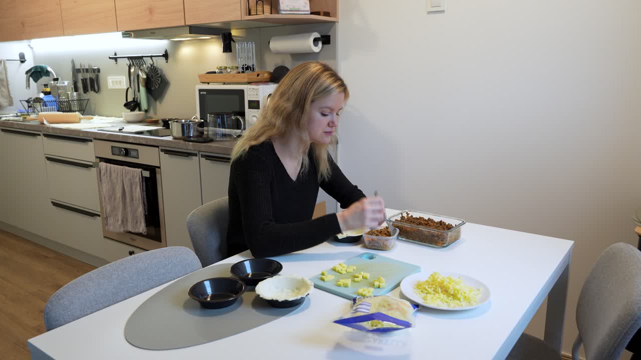 Homemade savory meat pies preparation in modern kitchen