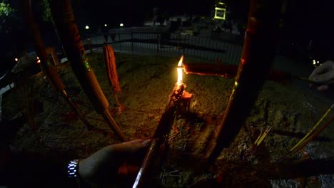 burning incense ceremony at night