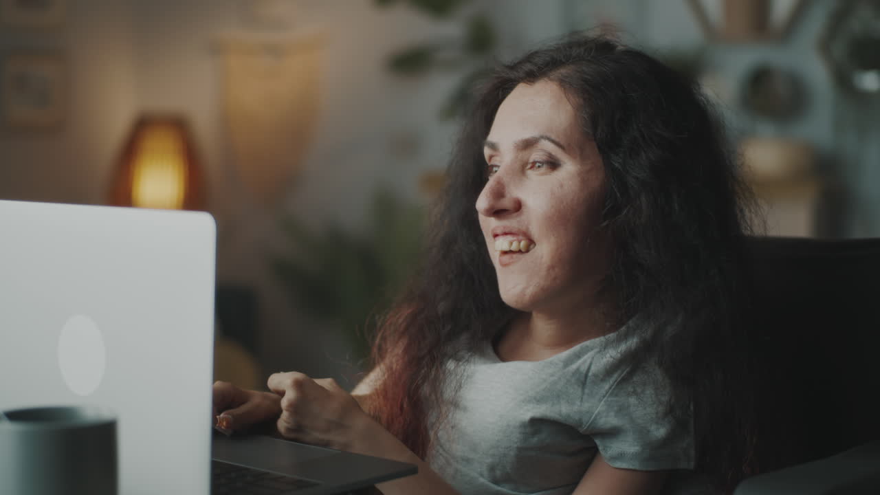 Woman with a Disability Having Video Call