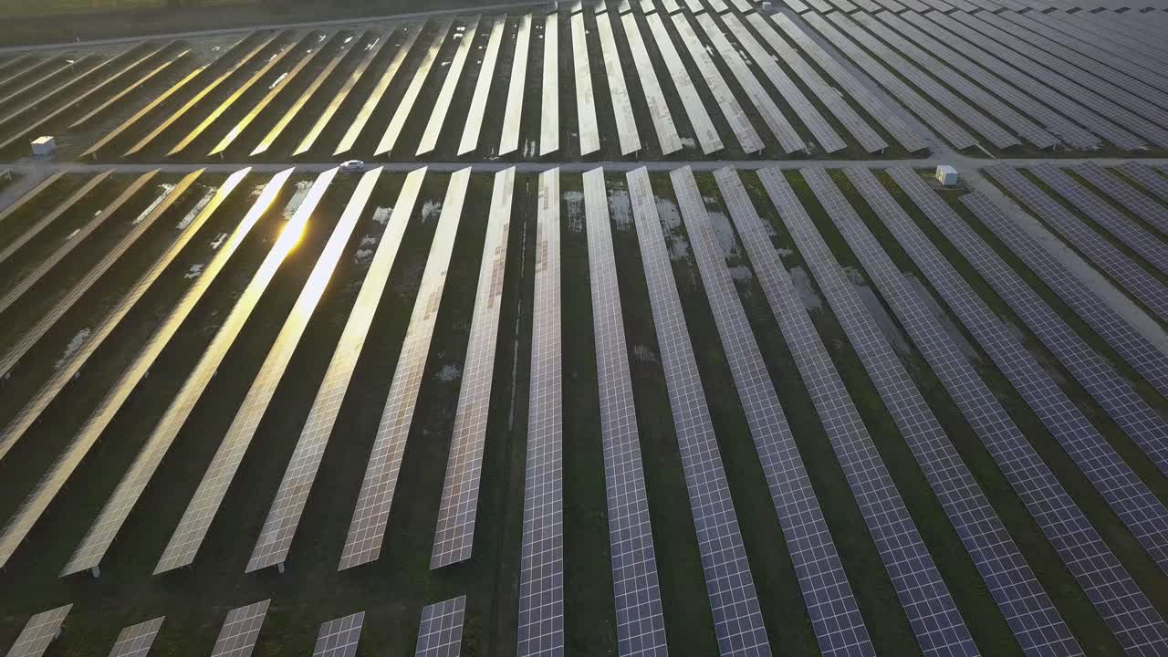 Aerial View of a Large Solar Farm at Sunset