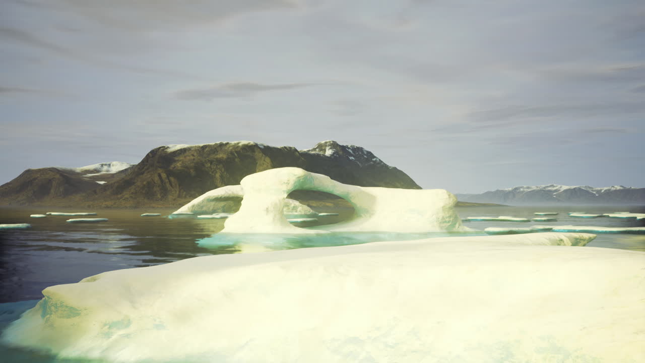 Spectacular ice arch stands tall amidst tranquil waters and mountains