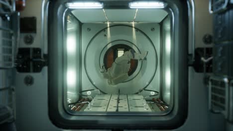 astronaut inside the orbital space station