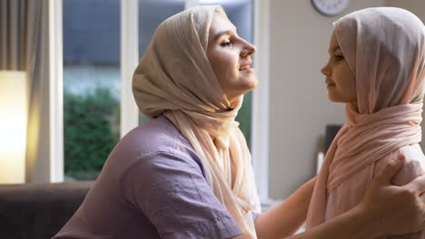 close-up view of mother and daughter at home.