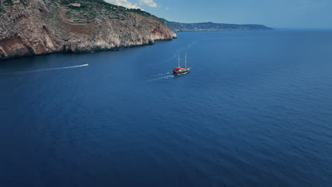 Discover-the-Salento-coastline-in-Puglia,-Italy,-with-stunning-drone-footage-featuring-a-boat-at-sea