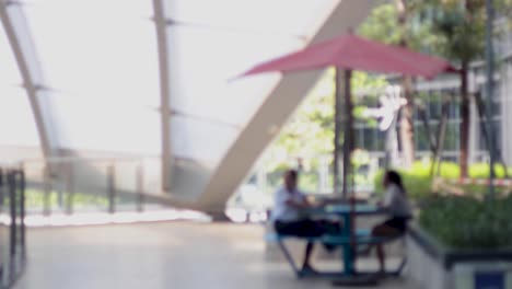 two individuals engaged in a discussion outdoors