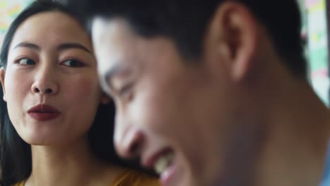 handheld view of young couple having happy time at cafe