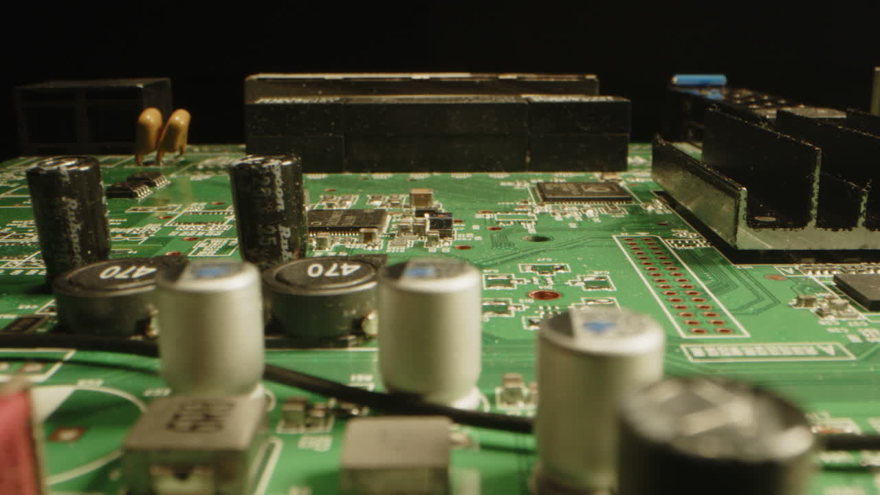 Beautiful macro dolly of a circuit board with many detailed components as diodes, chips and transistors