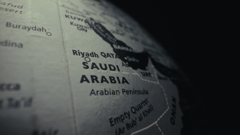 close-up of a world globe focusing on saudi arabia