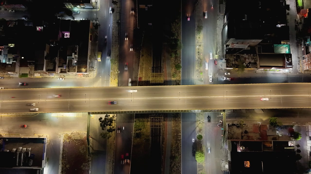 Night drone hyperlapse of overpass traffic in Mexico City