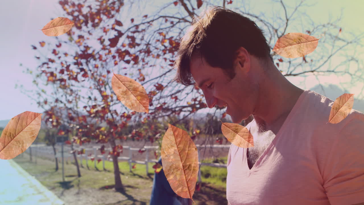 공원에서 행복한 백인 아버지와 딸의 잎의 애니메이션