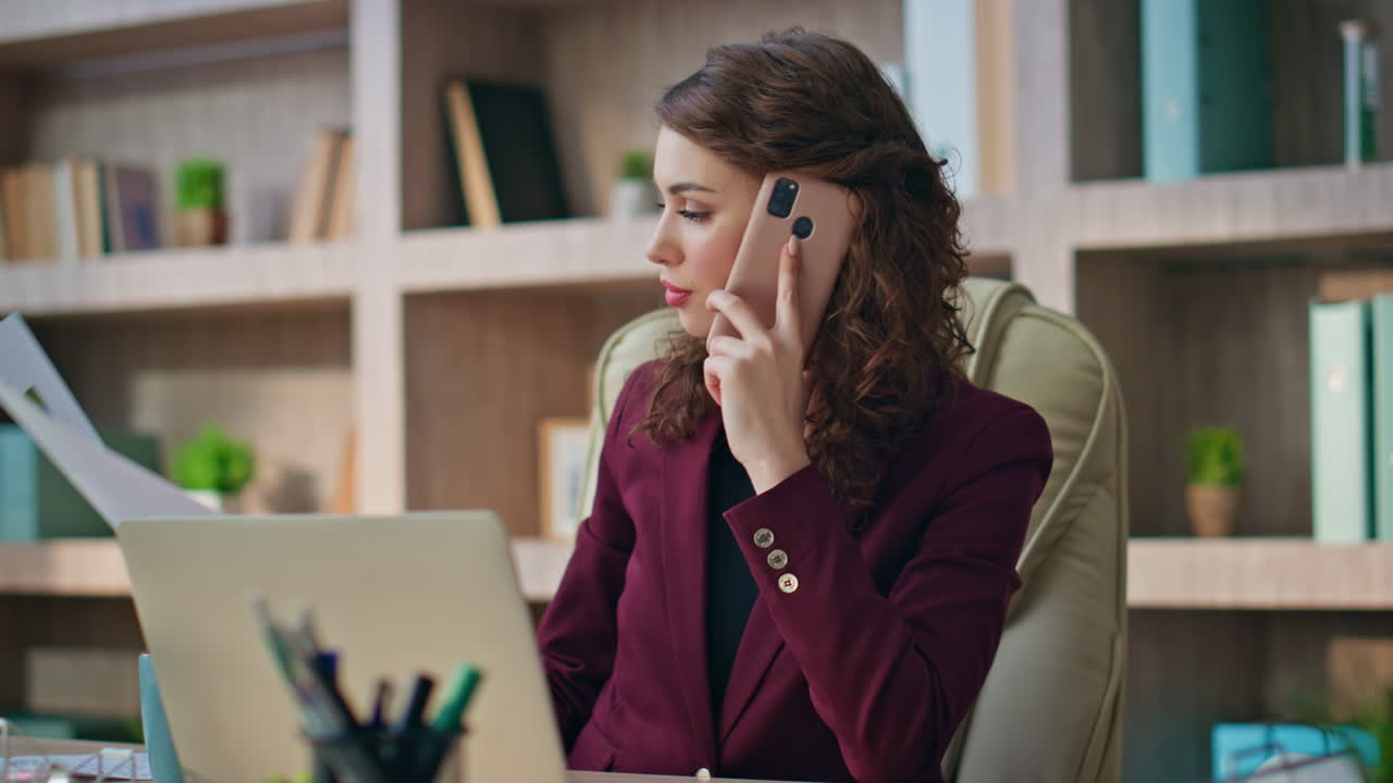 Finance manager communicating cellphone at desk closeup. Young executive discuss