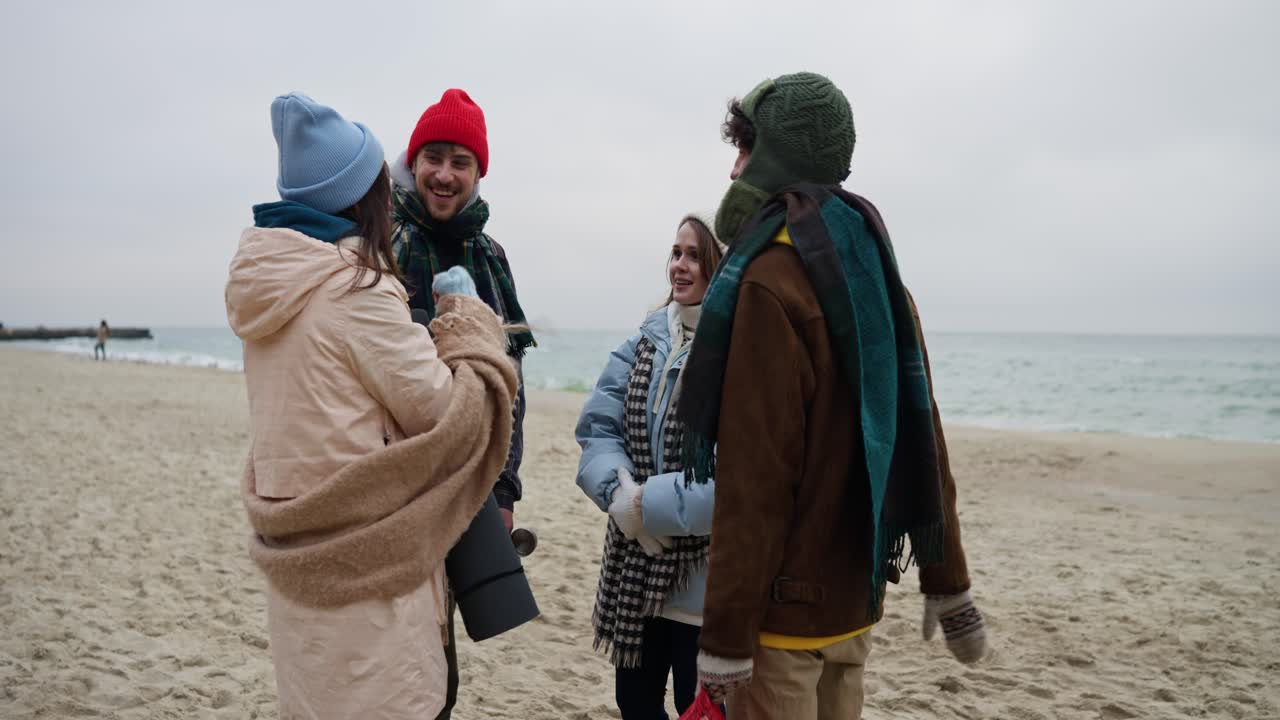 Friends enjoying a winter beach day
