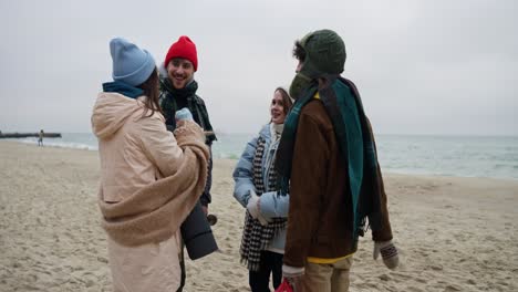 friends enjoying a winter beach day