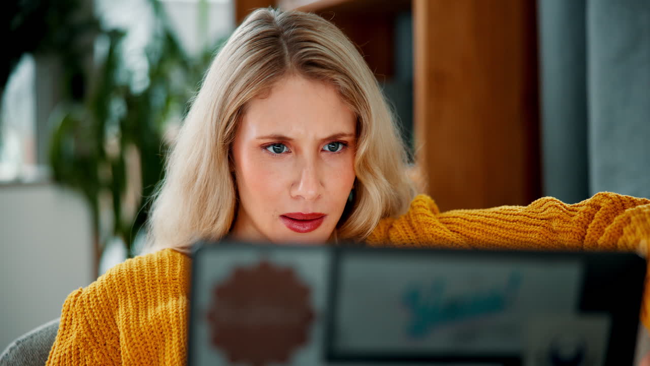 Woman using laptop indoors