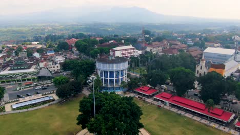 Magelang-town-square-with-banyan-tree-in-middle-and-Water-Tower,-Indonesia