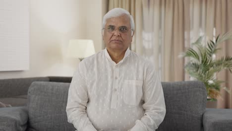 indian old man staring at the camera