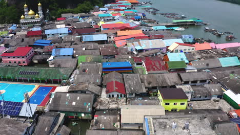 clustered shacks and houses of koh panyee floating village in thailand