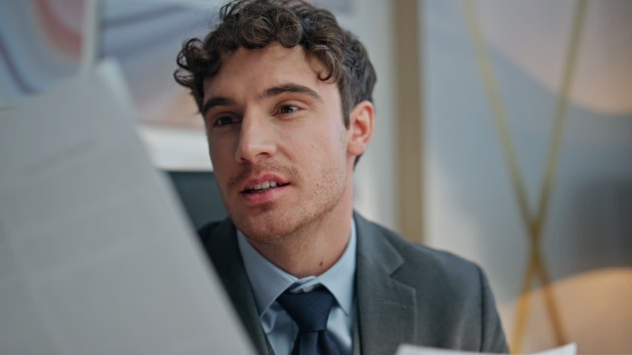 Smiling businessman examining documents working office closeup. Man reading