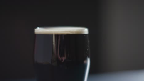 close up of pint of irish stout in glass to celebrate st patricks day 18