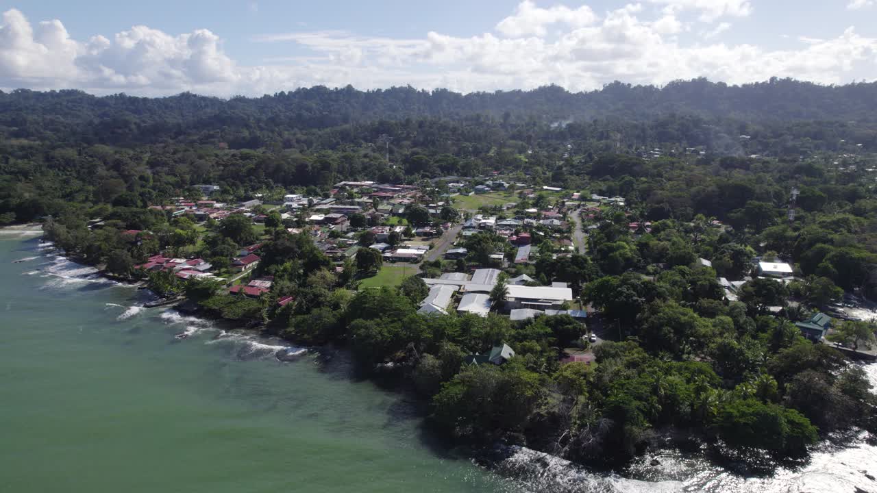 Aerial View of Cahuita Village nestled along Costa Rica's lush Caribbean coast. Parallax Shot