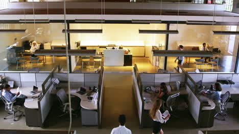 elevated view of staff working in a busy open plan office