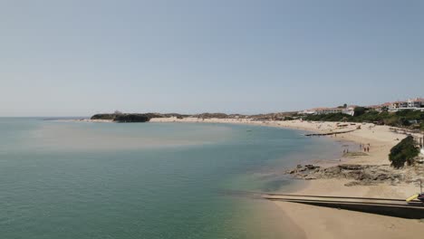 Aerial-Flying-Over-Boats-Floating-Mira-River-With-View-Of-Praia-da-Franquia-At-Vila-Nova-de-Milfontes