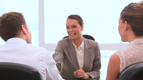 Handshakes-between-a-businesswoman-and-a-couple