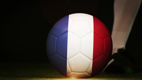 football player kicking france flag ball