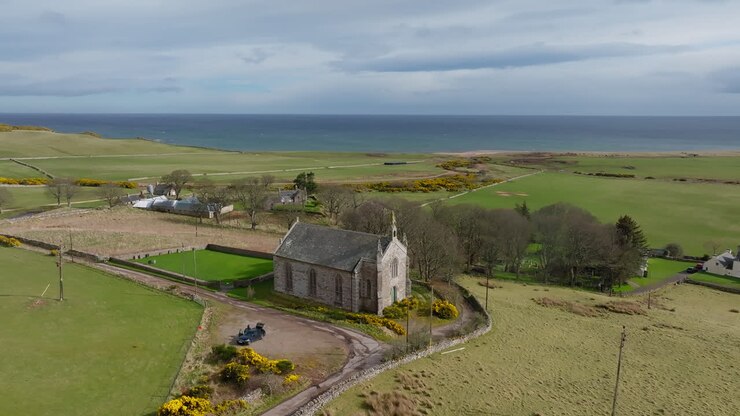 New Loth Burial Ground in Scotland with Coastal Landscape and Historic Church in Rural Countryside Setting