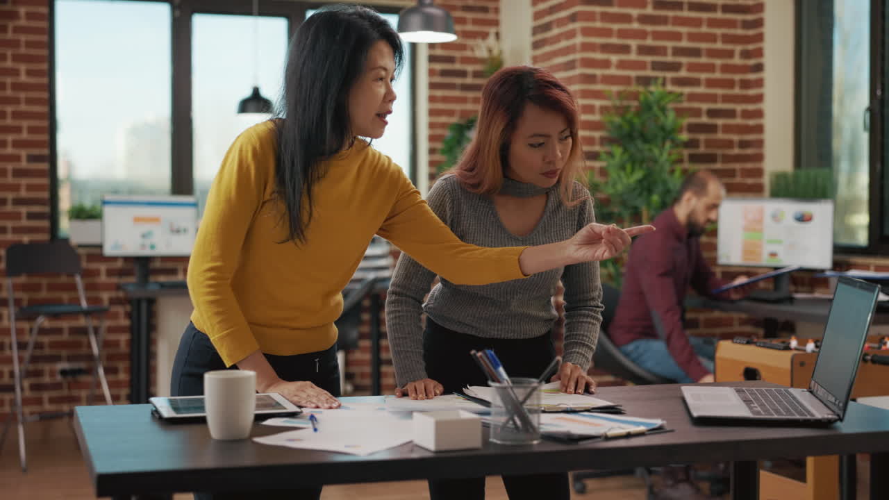 Coworkers doing teamwork on investment project