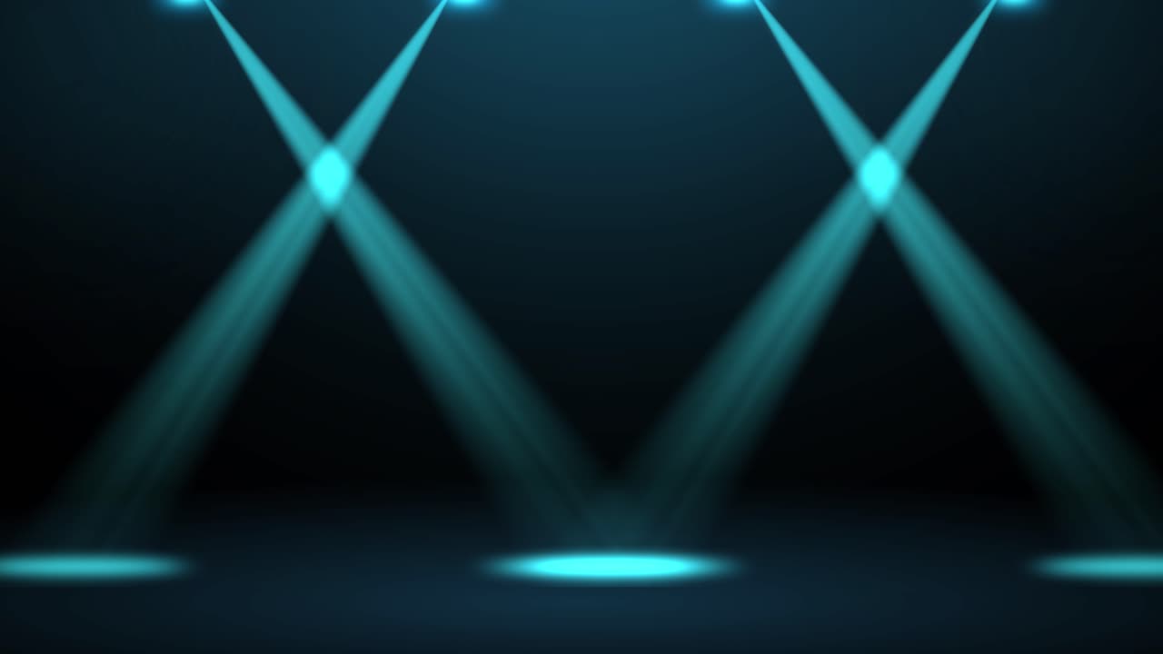 Blue spotlights moving in synchronized patterns
