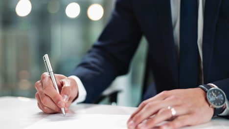 businessman signing a contract with a pen in the office