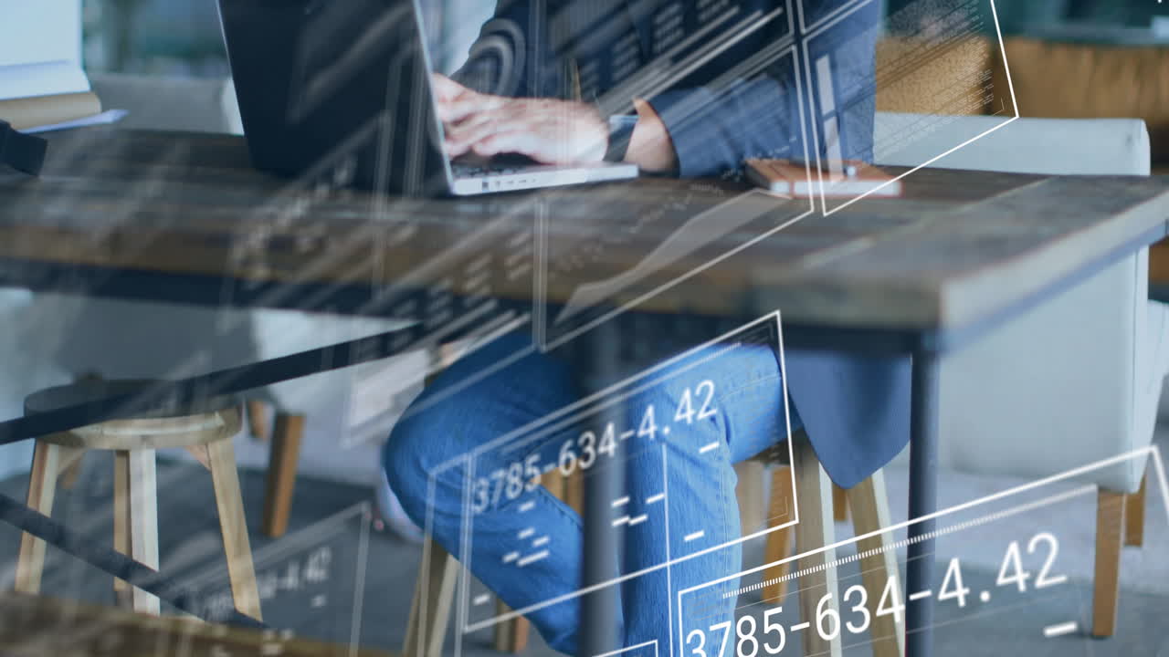 Business person working on laptop with digital data overlay animation